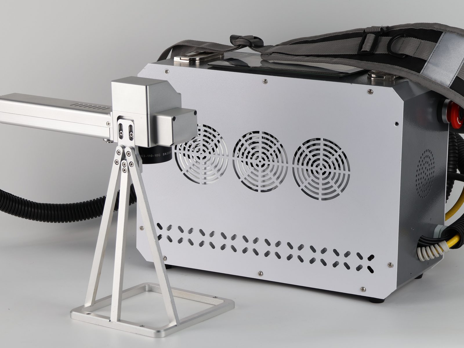 Portable backpack pulse laser cleaning system with handheld head and support stand