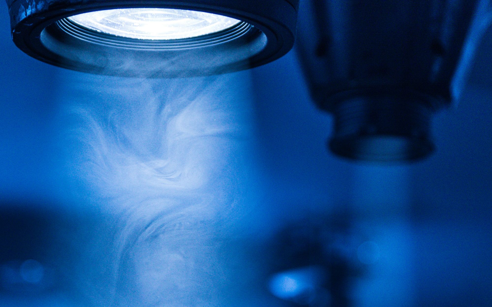 Blue process light inside an enclosed laser system